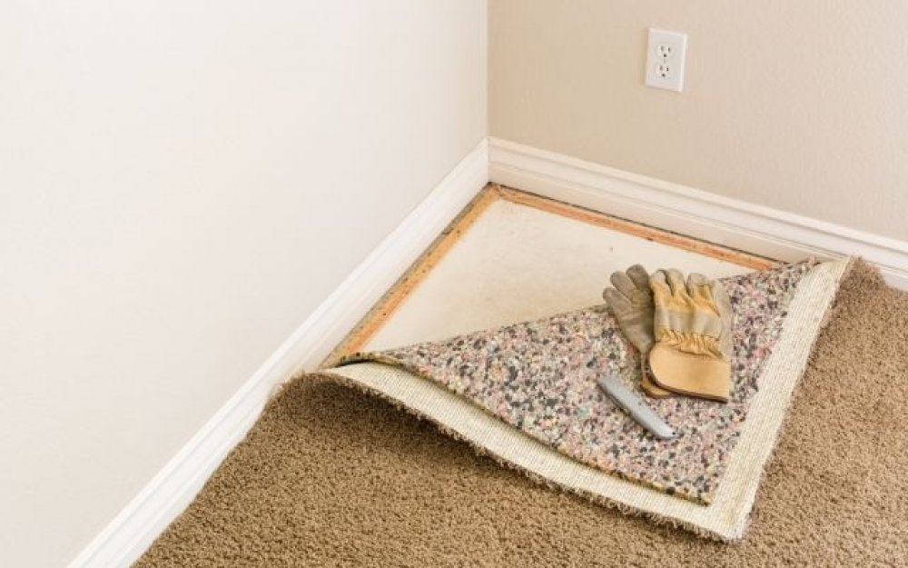 a carpet peeling up in the corner